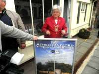 Drem station on 16 August, with East Lothian Provost Sheena Richardson alongside one of the colourful new posters - see news item.<br><br>[John Yellowlees 16/08/2011]