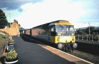 47 703 <I>St Mungo</I> with an evening train for Edinburgh at Dunbar in August 1985. Note the cast-iron lamps on the disused platform.<br><br>[David Panton /08/1985]