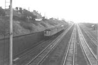 On a dull, overcast day in April 1969, a Kilmacolm-bound DMU is about to take the dive-under to the Princes Pier line at Elderslie. <br>
<br><br>[Colin Miller /04/1969]