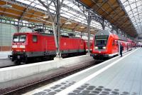 DB 112-142-5 awaits departure from Lubeck station on 28 July 2009, while the driver of the train for Hamburg Hbf on the adjacent platform also waits, albeit a little less patiently, given that his train is already running 15 minutes late.<br><br>[John Steven 28/07/2009]