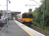 318 257 at Hyndland with a westbound service from the Argyle Line on 8 August 2009 (318s and 334s serve Argyle Line, 320s are North Clyde only).<br><br>[David Panton 08/08/2009]