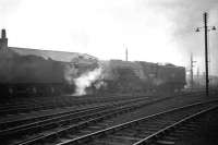 View south west across the yard at 62B Tay Bridge shed looking towards the river around 1965, with A2 Pacific no 60530 <I>Sayajirao</I> on shed. 60530 spent her last two years here as a Dundee standby locomotive before being withdrawn in November 1966. The shed was officially closed in 1967 and demolished in 1969. The building visible through the haze in the right background with the large roof vents made way for subsequent retail developments, (including the Tesco Superstore), that now stand on  Riverside Drive. [Editors note: As a young enthusiast this was, without doubt, the most widely mis-spelt and mispronounced name carried by any locomotive, with the majority of my fellow likely-lads settling for the cheery, if slightly suggestive, <I>Sir Jerry... Oh!</I>]<br>
<br><br>[Robin Barbour Collection (Courtesy Bruce McCartney) //1965]