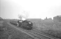 61418 brings the <I>Durham Rail Tour</I> round the east to south curve from Haverton Hill station on 13 October 1962 on its way back from Port Clarence to Stockton. The building in the left background is the former Haverton Hill locomotive shed, closed in June 1959. <br><br>[K A Gray 13/10/1962]