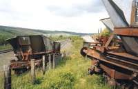 Wrecked HAAs at Dunaskin in May 2004, the result of a derailment in 1990. They lay there for approximately 19 years and I gather that they have just been removed. On the left is the Network Rail line to Chalmerston, then the ARPG line.<br>
<br><br>[Colin Miller /05/2004]