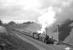 B1 4-6-0 no 61349 takes an up train away from Tynehead station in April 1964. Access to the platforms is via a steep stairway on each side of the road bridge in the background, with the station building standing on the east side of the bridge.  Out of sight to the right of the station building is the goods yard, the apparent climb up to which looks a little challenging! However, there is something of an optical illusion about this location as the steep climb is actually being tackled by the B1 on the main line. [With thanks to David Kerr] <br>
<br><br>[Robin Barbour Collection (Courtesy Bruce McCartney) /04/1964]