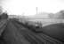 Stranger on the Waverley route. Black 5 no 44771 of Rugby shed heads south through Hassendean with a freight in the 1960s.<br><br>[Robin Barbour Collection (Courtesy Bruce McCartney) //]