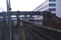 Looking west from a DMU leaving Southampton Central on a Saturday afternoon in May 1985. A Brush Type 4 is at the head of a service on the right, with a 2 car EMU standing alongside.<br><br>[John McIntyre /05/1985]