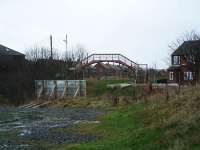 Ryhope looking to Durham with a footbridge at the former station. Over the now missing roadbridge the trackbed has been converted into a footpath and in the foreground some ballast remains on an unconverted stretch. Behind the camera the line ran north to Ryhope Grange Junction. The line closed in 1991 having latterly served Hetton Colliery (Hawthorn) with a complicated trip; Sunderland South Dock - Hawthorn (load) - Tyne Central Coal Terminal at Tyne Dock (unload, run round) - Ryhope (reverse) - Sunderland South Dock.<br><br>[Ewan Crawford 20/03/2004]