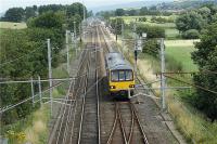 Looking north up the WCML towards Carnforth as the Northern Rail once a day Leeds to Heysham Harbour service approaches Hest Bank in the hands of 144010. It was noted that the destination display was showing Morecambe which presumably was due to the Class 144 not having Heysham Harbour on the list of stations.<br><br>[John McIntyre 11/08/2009]