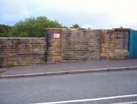 Filled in remains of former entrance door and window to Crigglestone West station (1850-1965), photographed in May 2009. The footbridge ran behind the main bridge parapet on extended piers. Unfortunately the wall cappings were recently stolen.<br><br>[David Pesterfield 19/05/2009]