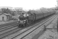 A Wemyss Bay to Glasgow express passenger service, hauled by a remarkably clean looking 80086, runs through Hillington West on the up fast line in August 1963.<br><br>[Colin Miller /08/1963]