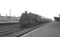 BR Standard class 5 no 73075 of Polmadie shed heads towards Glasgow on the up fast line through Hillington West with a extra in May 1963.<br><br>[Colin Miller /05/1963]