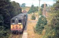 The <I>'last freight that wasn't'</I> is seen here passing through Canonbie (hauling the extra brake van) in August 1967 following its visit to Langholm. The train is running back towards Riddings Junction, from where it will head north to Newcastleton.<br><br>[Bruce McCartney /08/1967]