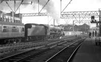 Royal Scot class 4-6-0 no 46121 <I>Highland Light Infantry, City of Glasgow Regiment</I> takes a train out of Glasgow Central in the early 1960s. The locomotive was eventually withdrawn from Polmadie shed at the end of 1962.<br><br>[K A Gray //]