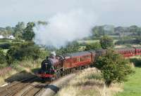 The sun has come out since Mark Bartlett photographed 5690 at Lancaster about an hour earlier. [See image 25098]. Having picked up passengers at Lancaster and Preston we now see it climbing away from the WCML at Farington Curve Junction on 19 August 2009 as it heads for the next pick-up at Bamber Bridge. The train is <I>The Fellsman</I> which is running every Wednesday at the moment from Lancaster to Carlisle and return.<br><br>[John McIntyre 19/08/2009]