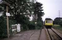 Aided by vigorous local support (and perhaps nuclear flask traffic), the line from Wickford to Southminster survived a difficult time in the 1960s and 1970s to achieve electrification and an upswing in fortune. Shown is a Southminster bound DMU entering Battlesbridge, the first station out from Wickford, in August 1977.  Waiting for a train here in bad weather was a particularly miserable experience - at the time there was no passenger shelter whatsoever. <br><br>[Mark Dufton 14/08/1977]