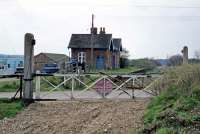 After closure to passengers in 1959, the attractive M&GN station at Attlebridge remained largely intact until after the disused track was lifted in 1976. Thereafter, the building was converted for use as a private residence and extensively <I>modernised</I>. This photograph shows the old station in April 1978 shortly before the rebuilding work got under way. Unfortunately, very little of the building's original character was retained. [See image 34119]   <br><br>[Mark Dufton 22/04/1978]