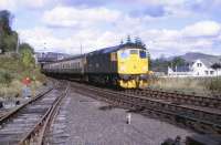 26024 running into Garve with a train from Kyle of Lochalsh on 25 September 1982 crossing LMS Black 5 no 5025 standing behind the camera.<br><br>[Peter Todd 25/09/1982]