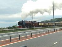 Stanier Pacific no 46229 <I>Duchess of Hamilton</I> runs alongside the A55 Expressway between Colwyn Bay and Llandudno Junction on 19 October 2002 bound for Holyhead with the Pathfinder Tours <I>Ynys Mon Express</I>.<br><br>[David Pesterfield 19/10/2002]