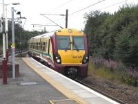 Juniper 007 pulls into Hyndland with a Dalmuir service on Saturday 8 August 2009. To my knowledge no EMU has yet been painted in the 'Scotland's Railway' livery (nor has a Class 158) but surely a 334 would look the most striking, so used are we to it's predominantly pale colouring (the only one it has had). Livery change seems to be a slow process: it took nine years from the first appearance of the SPT maroon and cream in 1997 to repainting of the last orange and black unit. On that basis maroon and cream will be around for another eight years. Exactly a year on since its first sighting  station signage rebranding seems to be the priority at present. [See image 20385]. (Incidentally, does anyone know if the superseded signs are for sale?)<br>
<br><br>[David Panton 08/08/2009]