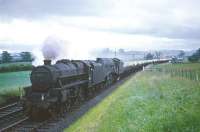 Black 5 no 45235 hauls an A4 and a car train north near Hassendean around 1964. <br><br>[Robin Barbour Collection (Courtesy Bruce McCartney) //1964]