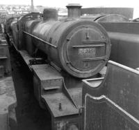 Having been withdrawn from 82F Bath (Green Park) in March 1964, ex-S&DR 7f 2-8-0 no 53808 stands on one of the Woodham Brothers scraplines at Barry in the Summer of 1966. Happily the locomotive was rescued from here 4 years later and had been fully restored by 1987. No 53808 can now be seen on the West Somerset Railway. <br><br>[David Pesterfield 08/08/1966]