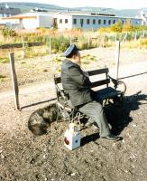 A guard and his dog relaxing between turns at Aviemore [Strathspey Railway] on 23 September 1993. [See image 13955]<br><br>[Ken Browne 23/09/1993]