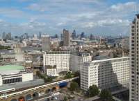 Trains to and from Charing Cross pass alongside the Royal Festival Hall on 23 August. Waterloo East station is just off picture to the right. View east from the London Eye.<br><br>[Alistair MacKenzie 23/08/2009]