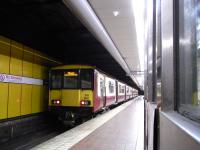 318 260 waits a few minutes at Glasgow Central Low Level station on 8 August 2009 before continuing its journey west with a Milngavie service.<br><br>[David Panton 08/08/2009]