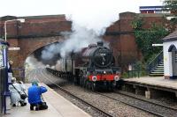 Ex-LMS Jubilee class 4-6-0 'Leander' is seen storming under Watkin Lane bridge and into Lostock Hall station as it heads east with 'The Fellsman' railtour on 26 August 2009. The weekly tours are evidently so popular that the promoters are now planning an extra tour later in September.<br><br>[John McIntyre 26/08/2009]