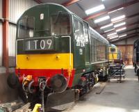 EE Type 1 20214, the former D8314, was built in 1967, withdrawn in 1993 from Thornaby and passed into preservation on the LHR. These days it is resplendent in BR Green paintwork and seen here in Haverthwaite shed, with visiting BRCW Type 2 27024 behind. <br><br>[Mark Bartlett 24/08/2009]