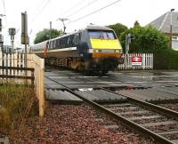 The National Express East Coast 0630 Newcastle Central - Glasgow Central via Edinburgh service passing over Kingsknowe level crossing on Saturday 18 July 2009.<br><br>[John Furnevel 18/07/2009]