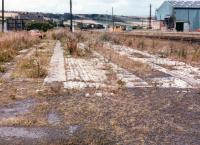 Filled in loco shed pits at Carlin How with Skinningrove Rolling Mills to right. View North 27 Aug 1985.<br><br>[David Pesterfield 27/08/1985]