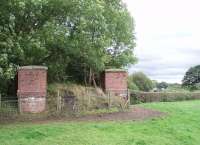 The remains of the bridge that, until 1963, carried the line to Pilling and Knott End over the Lancaster Canal, which can be seen to the right of the picture.  The original height of the trackbed can be seen but in the field all trace of the line has been removed and only the boundary hedge remains.  For a view of the bridge remains from the towpath [See image 19403].<br><br>[Mark Bartlett 31/08/2009]