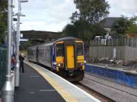 Work on the 'dynamic loop' appears to be on schedule with all traffic<br>
temporarily switched to the new platforms at Dunlop and Stewarton <br>
allowing the other (previously sole) platforms, to be rebuilt from <br>
scratch, or so it seems.Trackwork is not yet complete at the Lugton <br>
end where the new line from the south reverts to the existing one for the time being.156 449 pulls into Platform 2 at Dunlop with a Carlisle service on 2 September 2009.<br>
<br><br>[David Panton 02/09/2009]