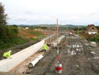 Construction activity alongside Station Road, Armadale on 28 August 2009. View is north east from the B8084 road bridge along the trackbed towards Bathgate.<br>
<br><br>[John Furnevel 28/08/2009]