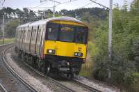 A Lanark - Milngavie service formed by 318 261 approaches Carluke on 31 August 2009.<br><br>[Bill Roberton 31/08/2009]