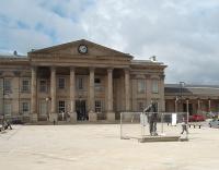 The square in front of Huddersfield's imposing station has been undergoing refurbishment during the summer. These works are almost complete although <I>Harold</I> is still fenced off. Former Prime Minister Harold Wilson was born in the town and his statue is a well known local feature.   <br><br>[Mark Bartlett 04/09/2009]