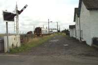 A westbound service passes the station at Errol and approaches the level crossing in August 1992.<br><br>[John McIntyre 10/08/1992]