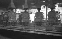 Gathering of J27s inside North Blyth roundhouse in the sixties featuring (L-R) 65788, 65878, 65830 and 65870. The building in the far corner is the shed office.<br><br>[K A Gray //]