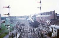 73069 backs onto the LCGB <I>Two Cities Limited</I> at Earlestown on 23 June 1968, taking over from 48033 which brought in the train. The class 5 will take charge for the next section of the railtour as far as Manchester Victoria (via a circuitous route) following which 48033 will handle the final leg back to Liverpool Lime Street. [See image 31407]   <br><br>[Robin Barbour Collection (Courtesy Bruce McCartney) 23/06/1968]