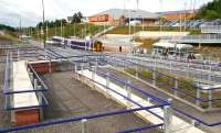 The new pedestrian approaches to Livingston North station are almost complete as seen in this view looking west on 28 August 2009. I found the scene strangely reminiscent of Robin Barbour's 1959 photograph looking over the livestock pens at Oliver's auction mart in Hawick. [See image 23300]  <br>
<br><br>[John Furnevel 28/08/2009]