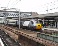 National Express liveried HST power car 43312 draws to a halt in the Up platform at Wakefield Westgate at the head of a Leeds to Kings Cross service on 4 September 2009. Although Westgate station has only two platforms they are signalled for traffic in both directions, as is the through road, with the station handling a frequent train service. <br><br>[Mark Bartlett 04/09/2009]