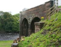 Just over a mile to the north of Kirkcudbright the branch crossed the River Dee on a viaduct at Tongland. The south abutment of the long demolished viaduct is seen here on 31 August 2009 looking across the Dee towards the next station at Tarff.<br>
<br><br>[John Furnevel 31/08/2009]