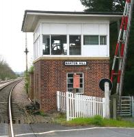 The signal box and level crossing at Barton Hill, North Yorkshire, on the York - Scarborough line, looking east towards Malton in April 2009. The former station here stood on the other side of the crossing and was closed to passengers in 1930.<br><br>[John Furnevel 19/04/2009]
