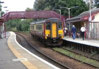 156 506 pulls into Giffnock heading for Glasgow Central on 2 September 2009. Inexplicably the East Kilbride-bound track looks more heavily used than the Glasgow side.<br><br>[David Panton 02/09/2009]