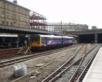 The Huddersfield to Sheffield line is in the news at the moment as Northern Rail plan to convert it to experimental <I>Tram Train</I> operation, although local rail users question the viability of the proposals. 142067 waits in the bay platform at Huddersfield on a siding that allows Sheffield trains to leave and arrive without conflicting with those on the main line to Manchester. <br><br>[Mark Bartlett 04/09/2009]