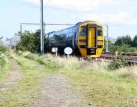 With electrification masts now stretching east towards central Edinburgh as far as the eye can see, DMU no 158786 has just run past the site of Balgreen Halt (closed 1967), at the former junction with the Corstorphine branch. In two years from now, westbound trams heading for Edinburgh Airport should be seen approaching along new tracks to the left from their previous stop at Murrayfield Stadium. 9 September 2009. <br>
<br><br>[John Furnevel 09/09/2009]