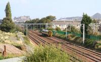 Scene at Saughton on 9 September 2009 as a 158 heads west under the masts with a Bathgate service. The ironwork in the bottom left of the picture is in connection with the new flyover that will eventually carry Edinburgh's trams over the line at this point.  <br><br>[John Furnevel 09/09/2009]