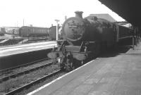 42195 (66A Polmadie) awaiting departure from Gourock with a Glasgow train in July 1965. Note the extensive carriage sidings in the background.<br>
<br><br>[Colin Miller /07/1965]